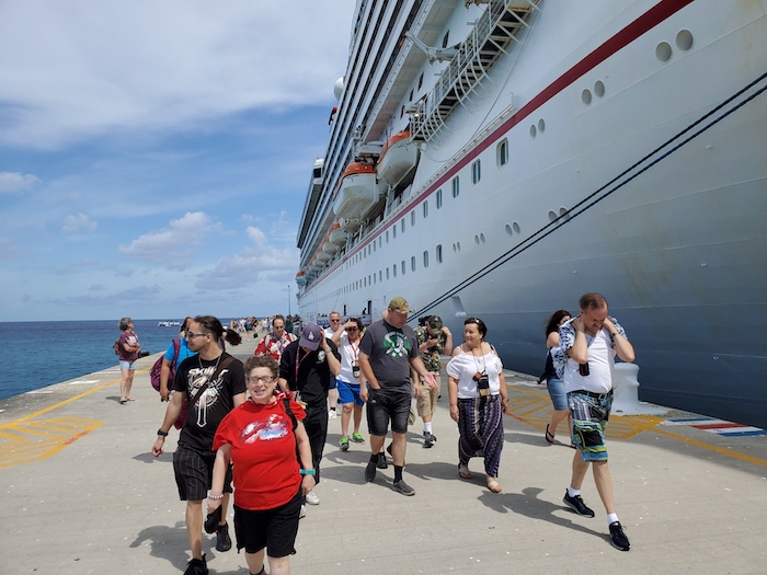 cruise guests leaving the ship